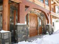 Entrance of LEED Certified Log Home, Custom Design during the winter at Government Camp, Oregon