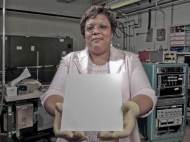 Wanda Peters holds some material with the lotus coating on it