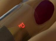 Micro-LED display printed on a thin sheet of plastic, wrapped around a finger
